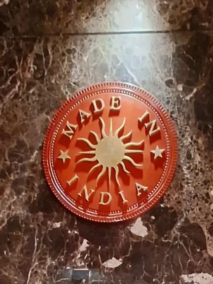 The "Made In India" logo embossed in marble. A touch of branding that reflects the restaurant's commitment to quality.