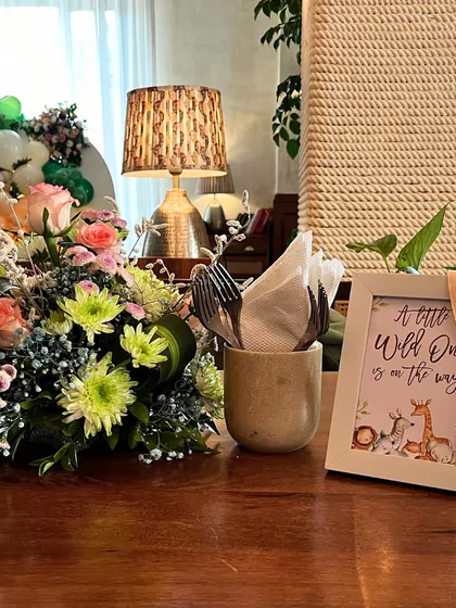 A personal touch on the table, with a framed sign that reads "A little Wild One is on the way." This detail reinforces the theme in a sweet and subtle way.