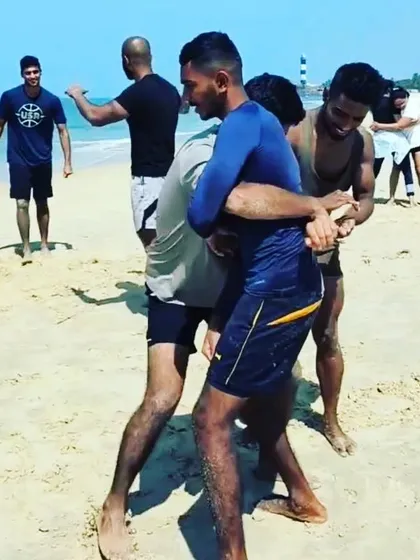 Here, members are practicing clinch work and takedowns on the beach. The uneven footing of the sand adds a layer of difficulty, improving balance and core strength. This is functional fitness in its purest form.