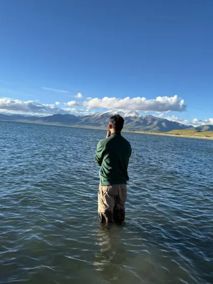 Facing the vastness of Lake Mansarovar, a mirror to the sky and the mountains. The stillness of the water reflects the stillness we seek within ourselves on this spiritual quest.