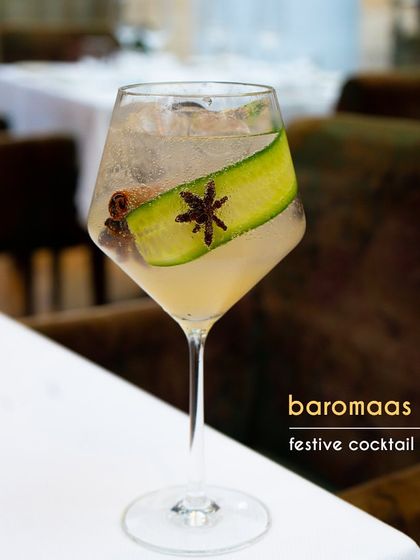 The Baromaas is our festive, all-seasons cocktail. Made with Tanqueray gin, a house-made cucumber cordial, and citrus, it's topped with prosecco for a sparkling finish. The cucumber and star anise garnish adds a final aromatic touch.