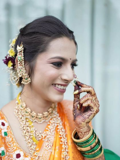 A candid close-up of the bride, capturing a natural, joyful laugh.