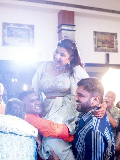 It's the unplanned, spontaneous moments of pure happiness that truly make a wedding. Seeing the bride lifted up by her cheering family is what our work is all about: creating an atmosphere where love and celebration take over.