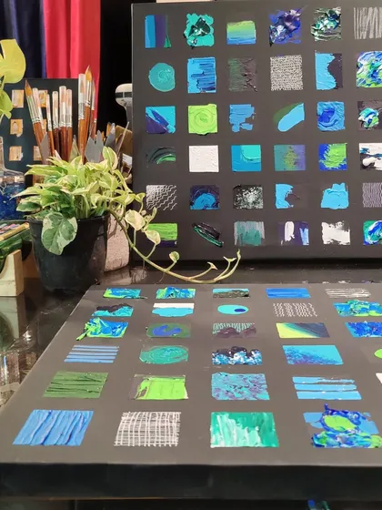The abstract panels in the studio, showcasing the different textures and brushstrokes.