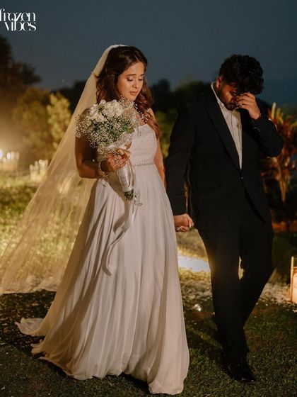 The groom overcome with emotion as he walks with his new wife. These are the powerful, vulnerable moments that make a wedding story so compelling.