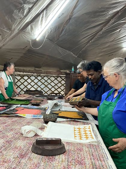 A group of textile enthusiasts from a Selvedge Magazine tour get hands-on experience. Our artisans are always eager to share their deep knowledge of printing techniques, from natural dyes to discharge printing.