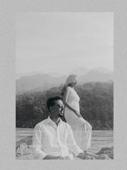An artistic black and white double exposure from a Rishikesh pre-wedding shoot, blending the couple's portraits with the mountain scenery.