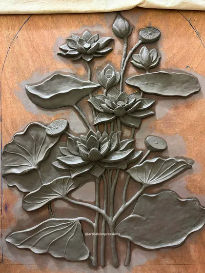 The full clay sculpture for the lotus mural, ready for the molding process. This piece showcases the balance between delicate details and a strong overall structure.