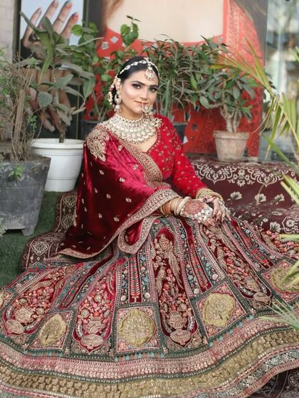 A full view of this magnificent velvet bridal lehenga. The detailed embroidery on the skirt tells a story, making it a piece you'll cherish forever.