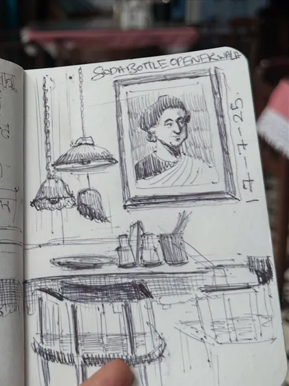 Another detail from my SodaBottleOpenerWala sketchbook spread, this time focusing on a portrait and the charming, old-fashioned decor of the cafe.
