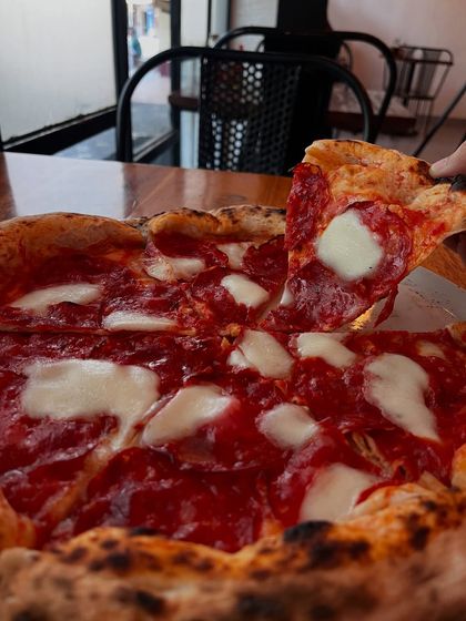 This pepperoni pizza, with its pools of mozzarella and perfectly cupped salami, is a sight to behold. A classic for a reason.