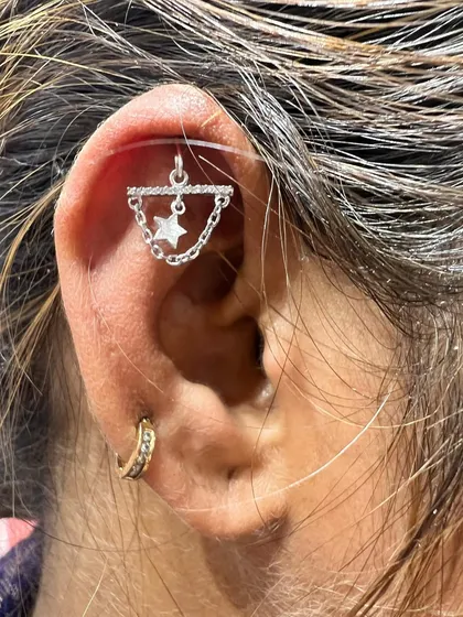 The same star and chain hanging from our celestial collection, shown again for its popularity and versatile style.