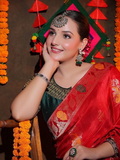 An entire Diwali-themed shoot featuring our red Banarasi saree. This series shows a complete concept, from decor to final look, providing rich inspiration for festive content.