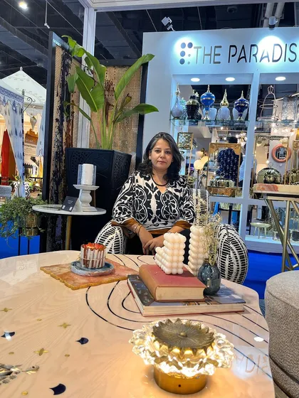 Another shot from our exhibition booth, where I'm seated at a custom-designed center table with beautiful inlay work. These events are a great platform to showcase our passion for bespoke, artistic furniture.