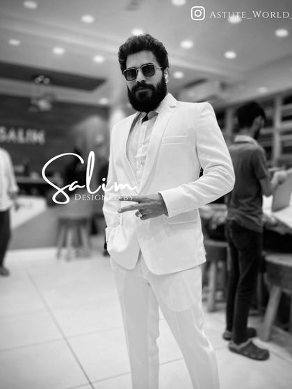 A client in a crisp, all-white suit. This bold and clean look is perfect for summer events or making a strong style statement.