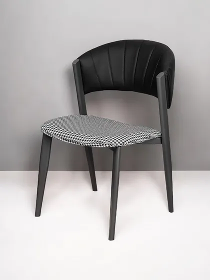 A full view of our modern dining chair with a houndstooth seat. The ergonomic backrest and padded cushion ensure comfort, while the design adds a touch of timeless style.