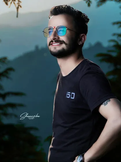 A cool and casual portrait against a beautiful mountain backdrop. The lighting highlights the subject's features and creates a great mood.