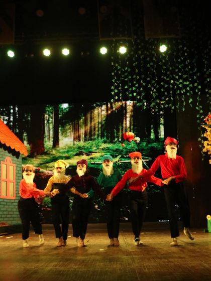 The seven dwarfs in a line. Each dwarf had a distinct personality that our dancers brought to life through their movements and acting.