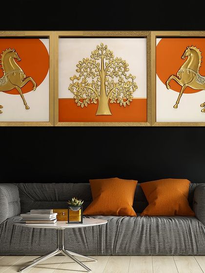 This triptych shadow box tells a story of majesty and tranquility. It features two golden horses flanking a central panel with a golden Tree of Life, all set against a bold orange sun.