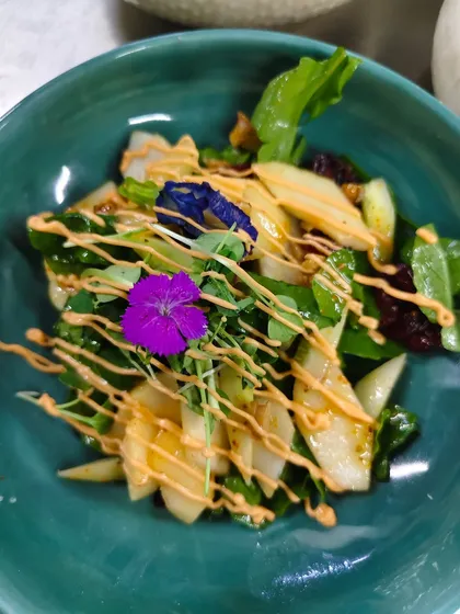 A salad that tastes like sunshine and blooms like spring. We use fresh greens, edible flowers, and a zesty dressing to create salads that are a feast for the eyes and the palate.