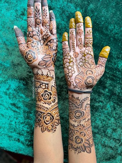 Another angle of the floral fusion mehendi, highlighting the contrast in styles.