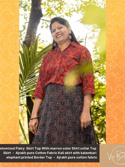 A full-length view of the custom Ajrakh skirt and top set, showing how the pieces move together. The elephant printed border on the skirt adds a whimsical, traditional detail.