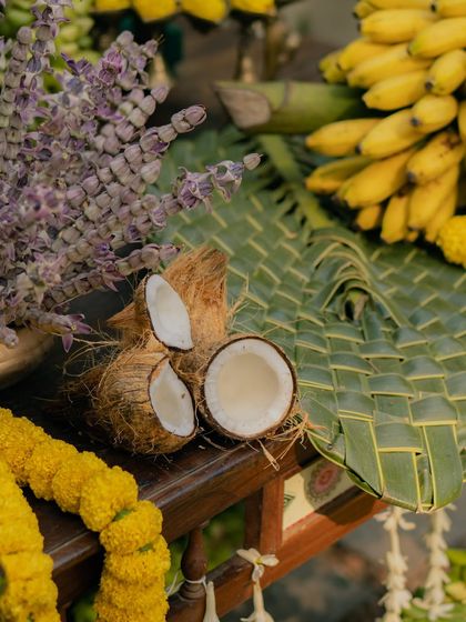 Weaving together elements of nature and tradition. Here, a split coconut sits beside a mat woven from fresh palm leaves, showcasing the beauty of sustainable and locally sourced materials.
