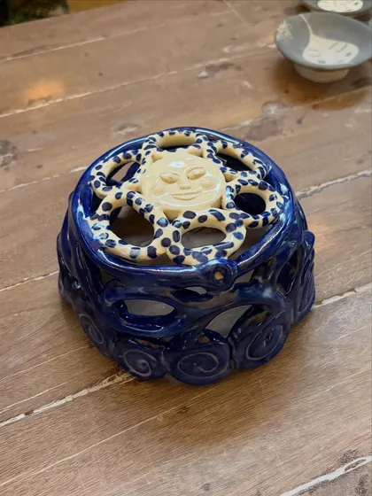 This student's quiet patience and steady curiosity shine through in these beautiful pieces from her beginner's course. The whimsical koi pond platter is a favorite, full of texture and calm joy.
