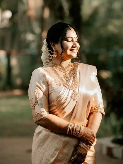 A happy, sun-kissed bride. Her makeup is kept warm and glowing, with a focus on defined eyes and a natural lip, letting her smile be the main accessory.
