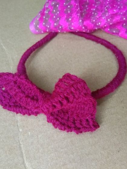 A simple yet elegant bow headband in a lovely magenta color. This is a versatile accessory that can be dressed up or down.