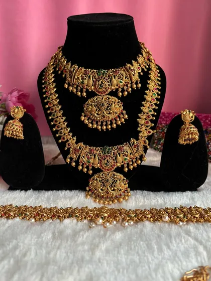 A full view of our peacock motif temple jewellery set. This grand set includes a choker, a long necklace, and a matching kambarpatta for a complete bridal look.