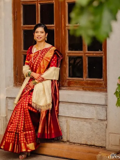 A bride in a classic red saree is a timeless combination. The makeup is kept elegant and clean, with a focus on flawless skin and defined features.