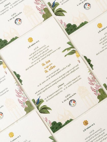 Another beautiful example of blending languages and art. This card features Gujarati text alongside illustrations of local birds and florals, creating a design that feels both personal and rooted in place.
