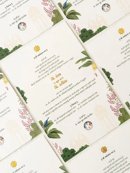 Another beautiful example of blending languages and art. This card features Gujarati text alongside illustrations of local birds and florals, creating a design that feels both personal and rooted in place.