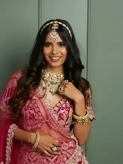 This is the bridal radiance I love to create. A gorgeous traditional bride with classic smokey eyes, a perfect pink lip, and soft, open waves, ready for her big day.