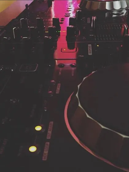 A close-up of my tools of the trade. The Pioneer DJ console is where all the magic happens, track by track, mix by mix.