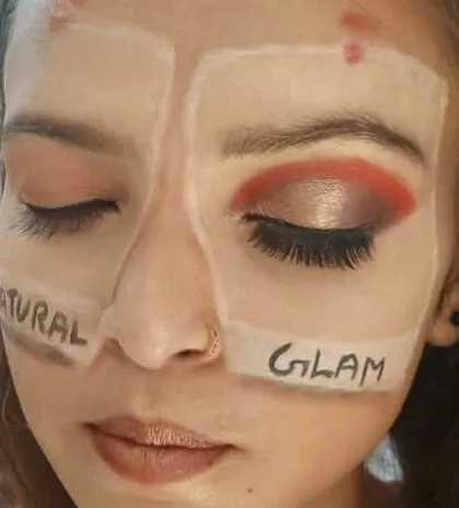This image shows our hands-on training method. Here, a student practices two different styles on one face, learning the techniques for a soft, natural look versus a dramatic glam look. This is how we build practical skills and muscle memory.