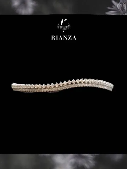 This minimal diamond wristlet features a unique, textured design. It's the perfect pick if you want a piece that is both simple and elegant enough for any outfit.