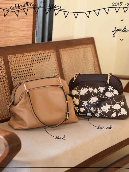 A beautiful shot of our Jordan frame bags in solid Sand leather and the elegant Lace Oak edit, showing the versatility of this design.