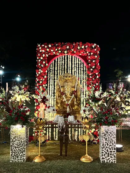 A divine beginning. This beautiful Ganesha installation, framed by a floral arch, is placed at the entrance to bless the couple and their celebration.