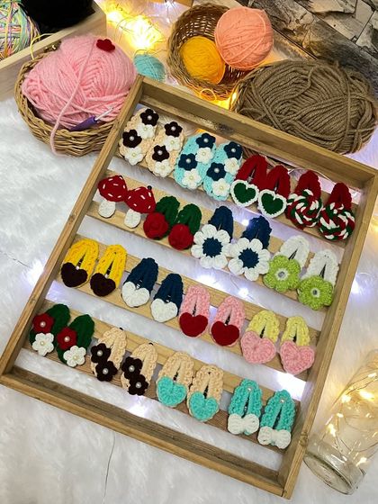 A tray full of my colorful and quirky crochet hair clips. These make great small gifts or party favors.