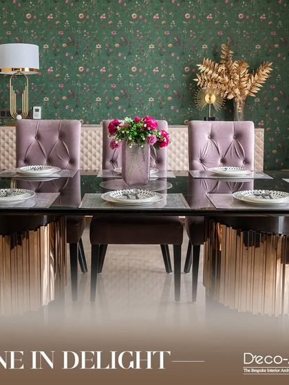 Experience the epitome of luxury dining with this exquisite dining area concept. The floral wallpaper, tufted pink chairs, and metallic table base create a space where you can dine in delight.