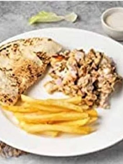 My shawarma platter gives you control over every bite. You get a portion of seasoned chicken, crispy french fries, and a piece of warm flatbread on the side.
