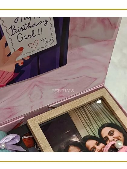 "Don't keep calm, it's your girl's birthday!" This vibrant hamper is filled with everything a best friend would love, including a personalized photo frame, all packed in a pretty pink marble-print box.