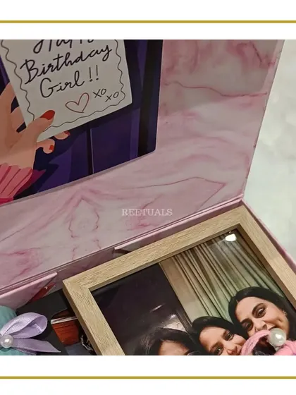 "Don't keep calm, it's your girl's birthday!" This vibrant hamper is filled with everything a best friend would love, including a personalized photo frame, all packed in a pretty pink marble-print box.