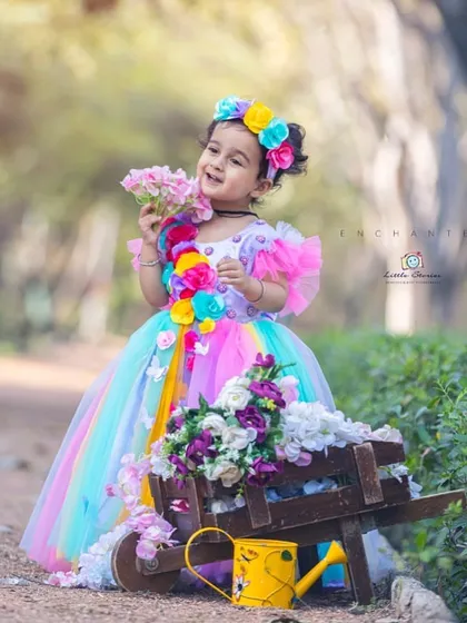 I believe every child deserves to feel like they are in a fairytale. For this enchanted outdoor portrait, I used a custom gown and floral props to create a whimsical scene that lets a child's imagination bloom.
