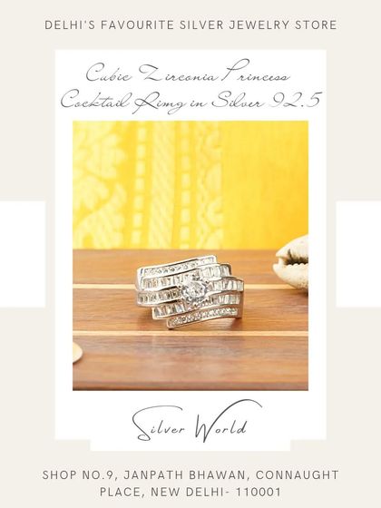 A glamorous princess cocktail ring featuring layers of baguette-cut zirconia. The architectural design gives it a modern and sophisticated feel.