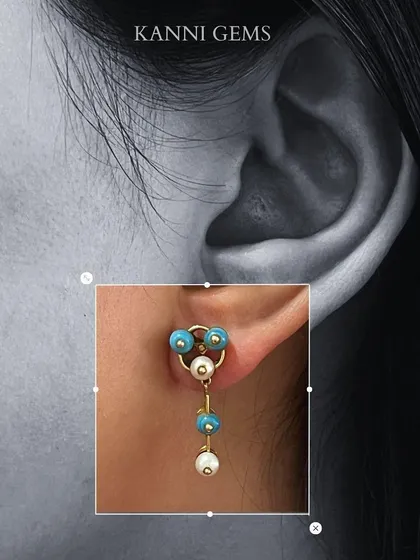 A more playful design, these drop earrings feature blue and white pearls. They are a testament to the intricate craftsmanship and dedication that goes into every piece I create.