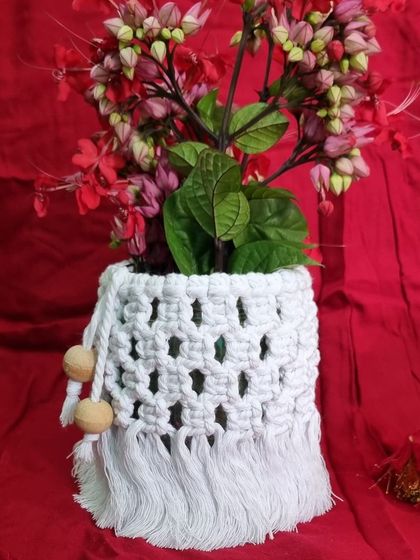 The same white jar cover transformed into a beautiful vase for a bouquet of flowers.