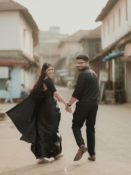 A beautiful "follow me" pose, full of energy and happiness. The old-world charm of the street makes for a unique pre-wedding photo location.